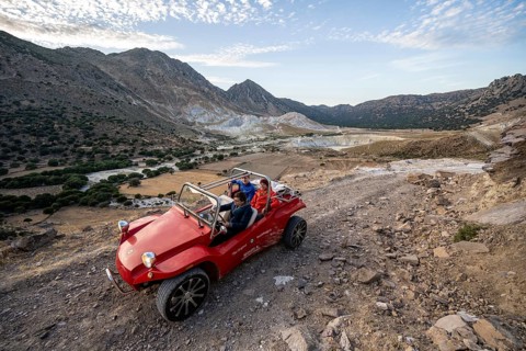 Red beach buggy on sandy track