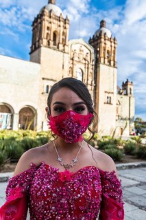 Beautiful dressed girl before the Church of Santo Domingo de Guzman