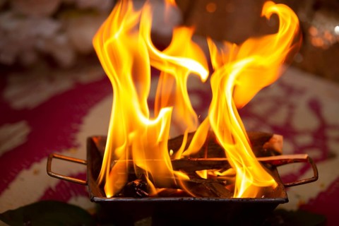 Close up of the offerings of Yajna at a Hindu wedding in Beau-Bassin