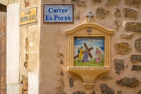 Road sign and Station of the Cross