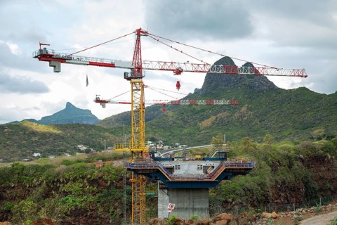 Construction site of bridge with crane across the Grand River of North West near the city of Beau Bassin