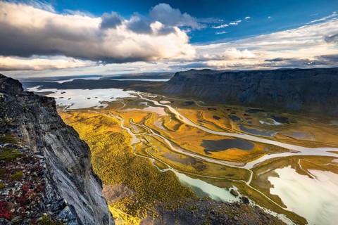 View from mountain Skierffe to the autumnal river delta Rapadalen