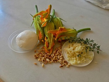 Courgette flowers with toasted pine nuts and mozarella ball