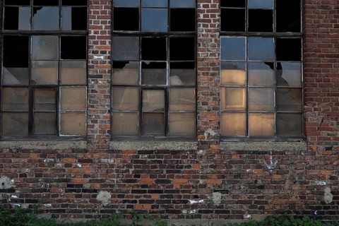 Brick house with factory fesnter of workshop at railway station