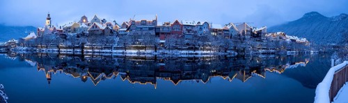 House facade of Frohnleiten reflected in the river Mur