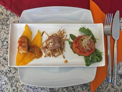 Tapa plate with mango slices