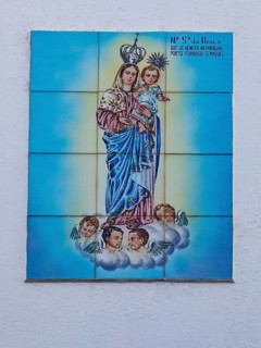 Typical Portuguese tile painting with saint motifs at the house entrances
