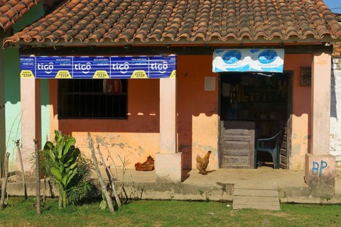 Small shop with chickens on the veranda