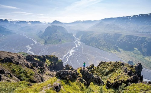 Hiker taking pictures of landscape