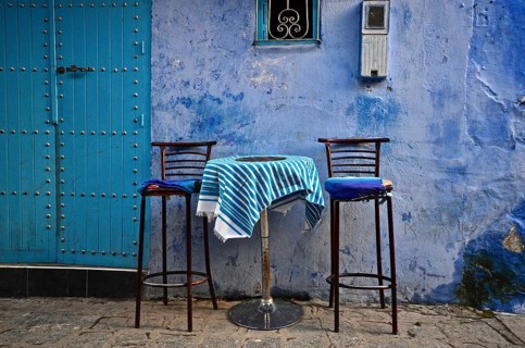 Alley with bar table and two high chairs