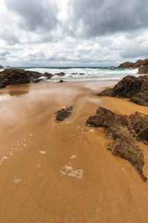 Rocks on the sandy beach