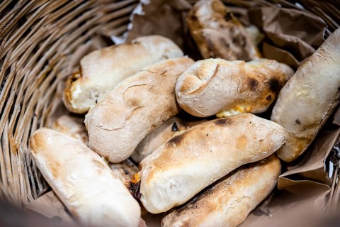Traditional bread rolls with cheese and chorico meat baked in wood-fired oven