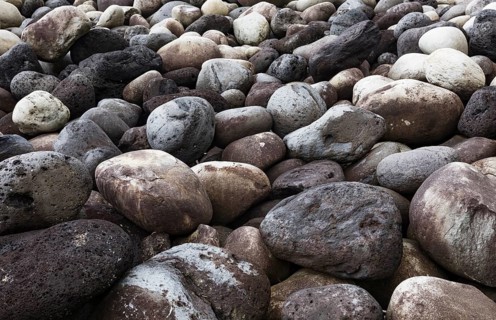 Large round stones on the coast of Rocha da Relva