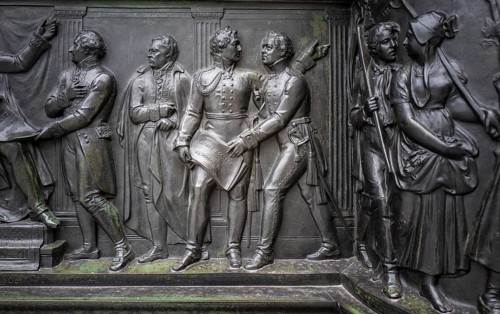 Bronze figures at the base of the monument to Frederick the Great Unter den Linden