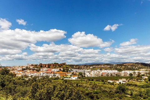 Silves cityscape with Moorish castle and cathedral on the top of the hill