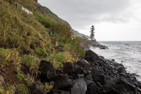 Hikers on the path along the coast to Rocha da Relva