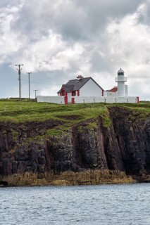 White Lighthouse on High Cliffs