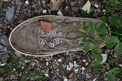 Light linen shoe with leaves on the bottom from above