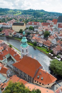 Town view from the castle tower with St.-Jost church and Vltava river