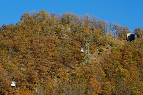 Cable car up the large castle hill in autumn