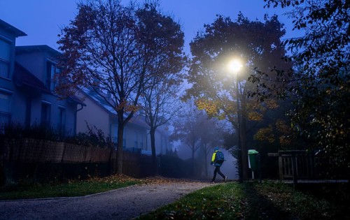 Schoolchild in foggy weather on the way to school in Markt Swabia