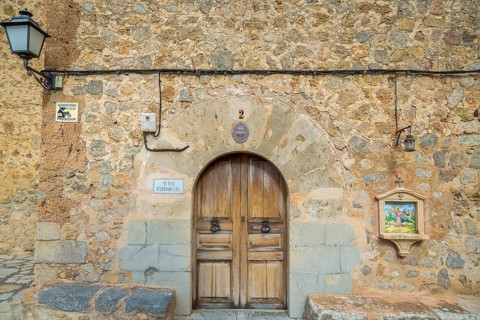 Wooden door with station Stations of the Cross
