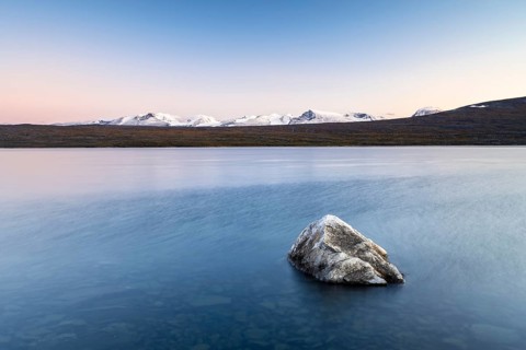 Lake Akkajaure and snowy mountains
