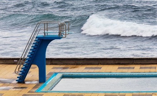 Swimming pool with diving tower on the Atlantic coast