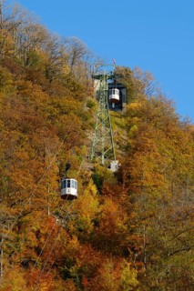 Cable car up the large castle hill in autumn