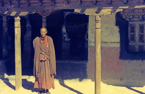 Buddhist monk in front of monastery in Tikse