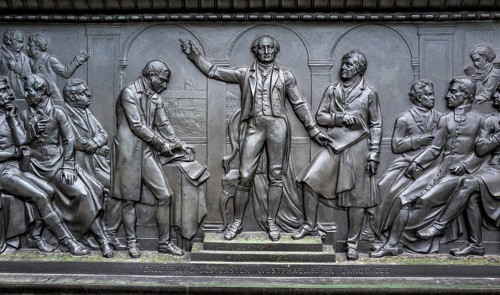Bronze figures at the base of the monument to Frederick the Great Unter den Linden