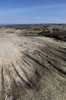 Erosion damage on an upland moor from vehicles and walkers. Swaledale