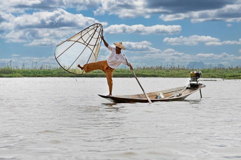Fisherman at Inle Lake with traditional Intha conical net