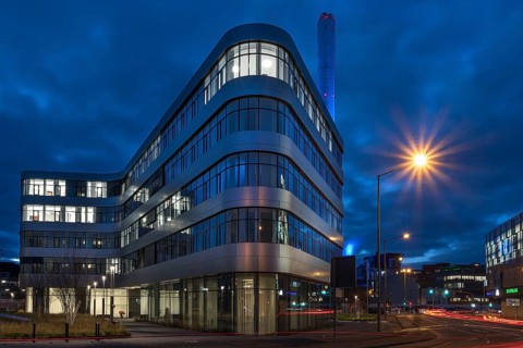 The district administration office and the chimney of the combined heat and power plant