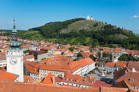 View from the border tower of the chateau to the old town with St. Wenceslas Church and view to the Holy Mountain Svaty kopecek