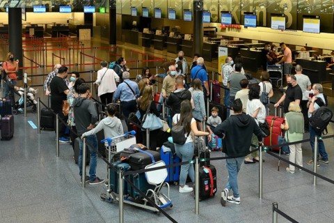 Passengers checking in at Zurich Airport