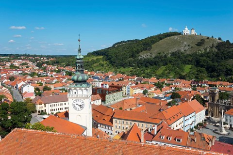 View from the border tower of the chateau to the old town with St. Wenceslas Church and view to the Holy Mountain Svaty kopecek