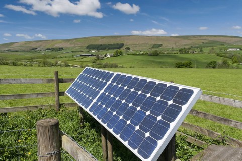 Solar panels on farm used to operate electric gate along farm track. Lancashire