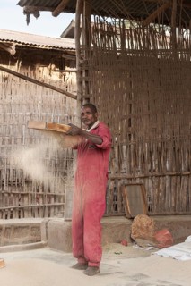 Man sifts flour
