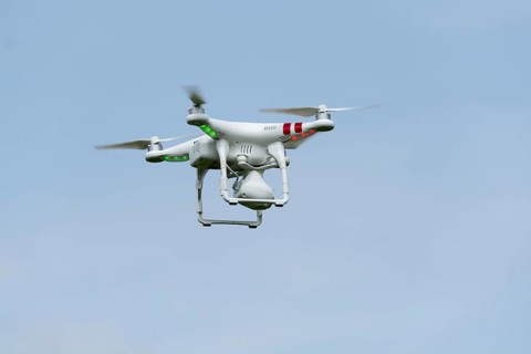 Camera drone in action in countryside