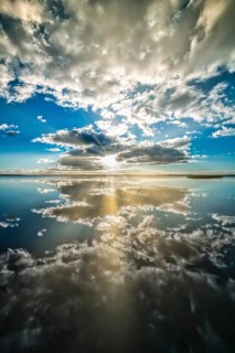 Filso with reflection of the clouds in the calm of the morning