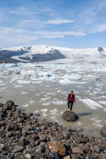 Woman in front of Fjallsarlon ice lagoon