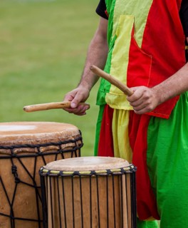 Musicians playing on an African djembe