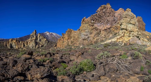 Colourful rocks of Roques de Garcia and Teide in the background