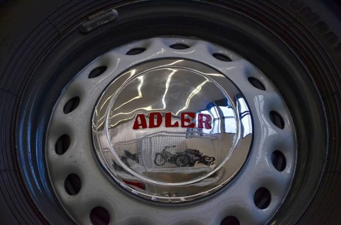 Reflection of motorbike in hubcap of car in Museum Neue Sammlung