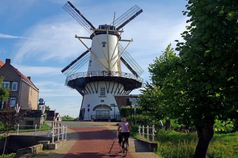 Old mill and cyclist