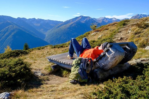 Hiker resting on the Waldburnnenweg