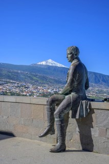 Statue of Humboldt behind the snow-capped Teide