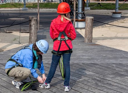 A woman and her niece prepare for their outdoor climbing trip