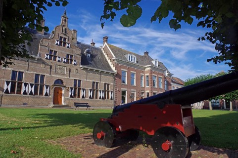 Cannon in front of typical Dutch houses